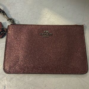 Authentic COACH cherry red glitter wrist slit bag